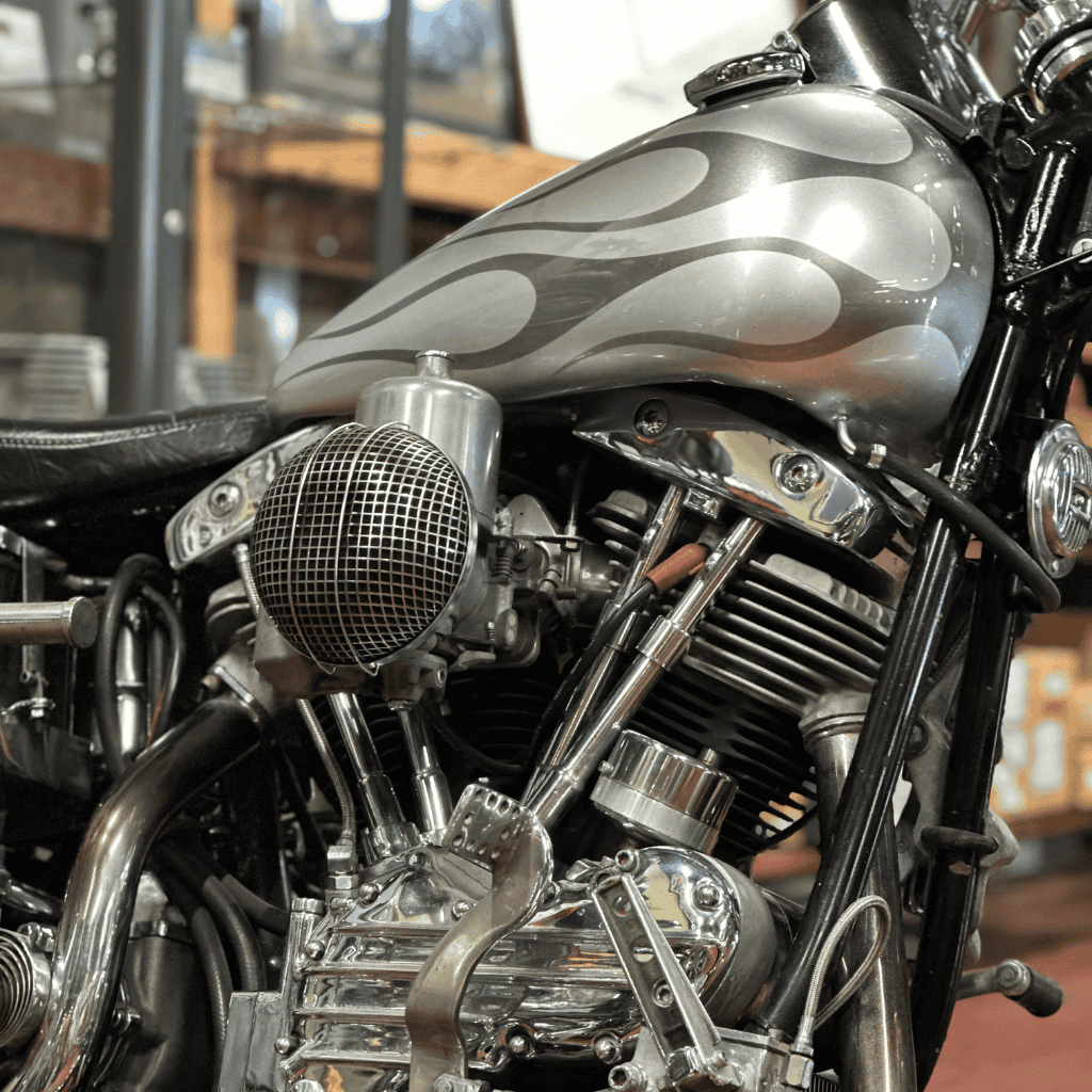 V8 motorcycle engine with custom grey flame paint and chrome details, ideal for motorcycle enthusiasts and motorbike lovers.